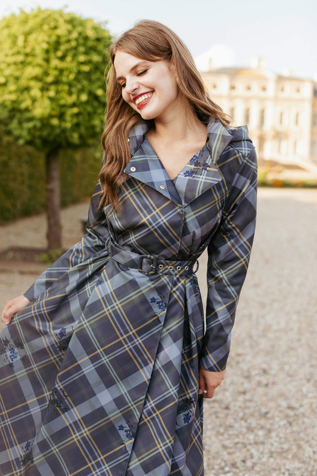Front view of Duchess in Blue coat with belted waist and pleated skirt.