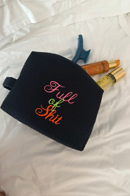 Navy Lillyloves Full Of Shit washbag with bold white text, rectangular shape, and zipper closure for toiletries and travel essentials.