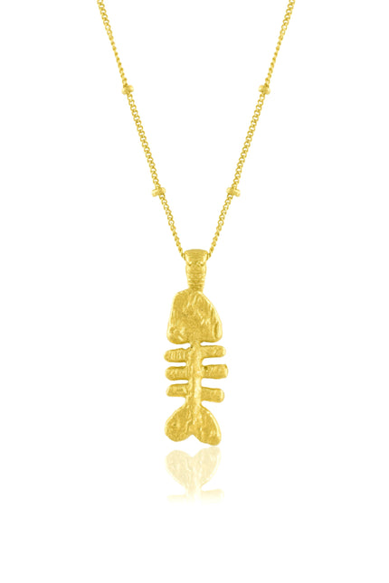 fish bone pendant necklace on a white background. Fish bone pendant  plated in real 22kt gold.