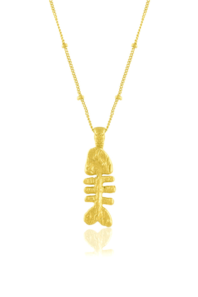 fish bone pendant necklace on a white background. Fish bone pendant  plated in real 22kt gold.