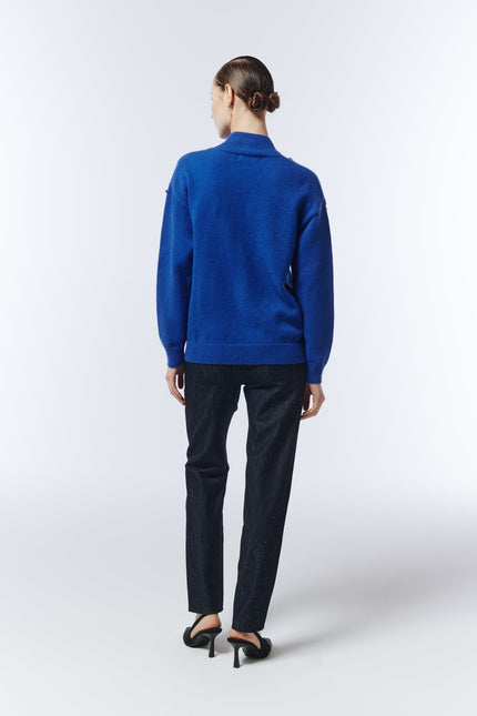 Back view of sapphire blue embellished jumper showing relaxed fit and ribbed hem by Sour Figs.
