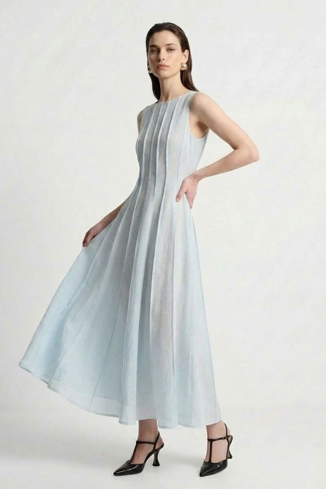 Woman wearing a light blue dress on a white background