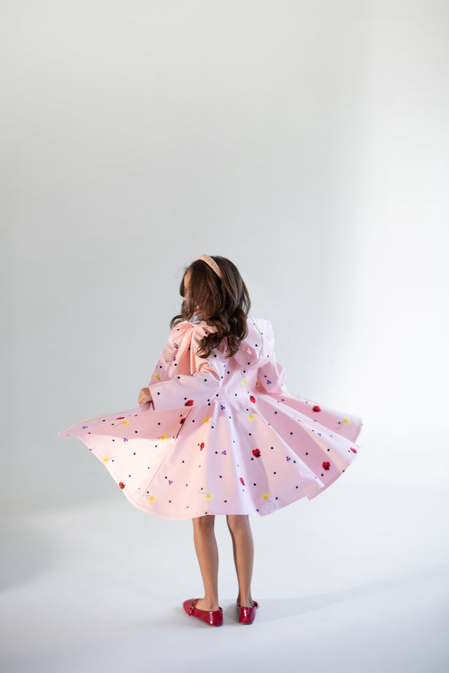 light pink girls coat from the back with beautiful flower print