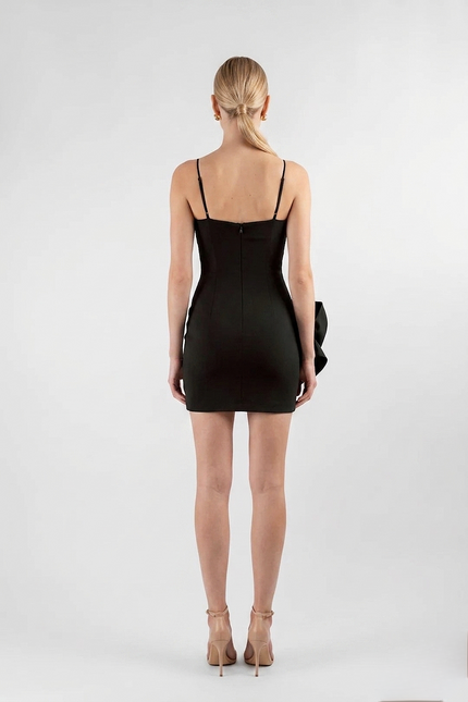 Woman wearing a black dress on a white background