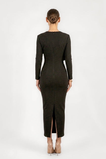 Person wearing a black dress with a back view on a white background