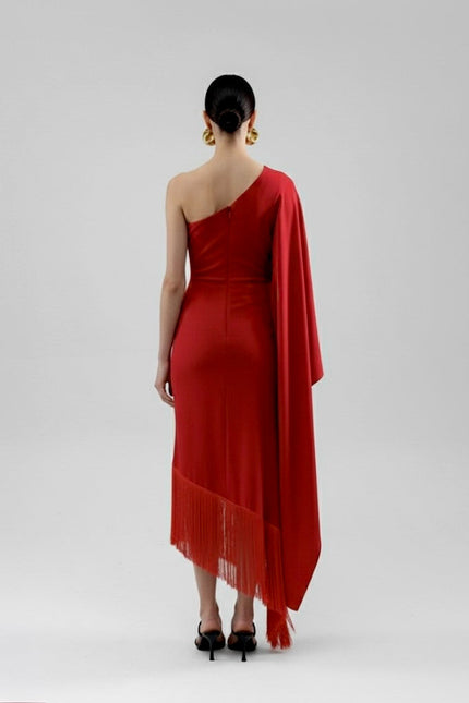 Red one-shoulder dress with a draped effect on a white background