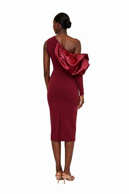 Red one-shoulder dress with a large bow detail on a white background
