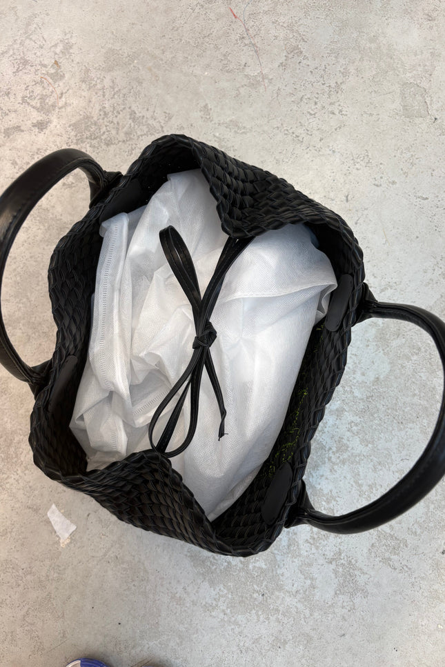 White Lilly Loves limited edition handbag with sleek design and subtle branding, perfect for stylish everyday wear.