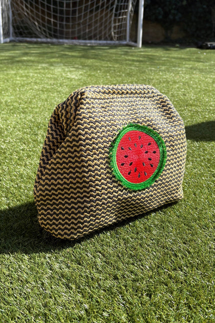 Lilly Loves fluffy watermelon pouch bag featuring a soft plush texture, vibrant green and pink colors.
