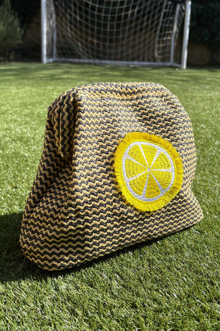 Lilly Loves fluffy lemon pouch clutch bag with soft texture and bright yellow color, ideal for accessories or small essentials.