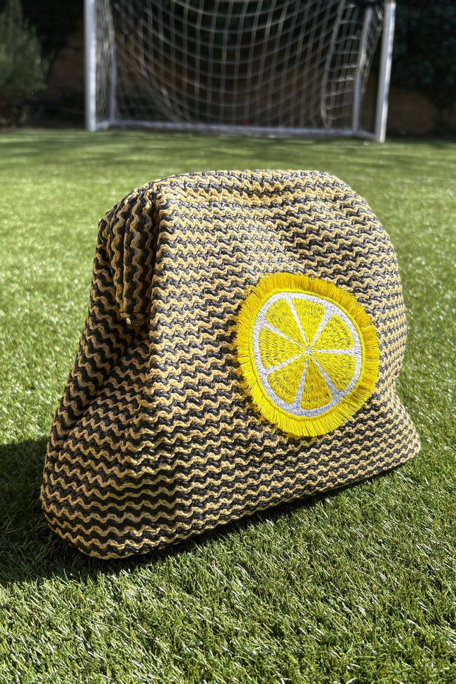 Lilly Loves fluffy lemon pouch clutch bag with soft texture and bright yellow color, ideal for accessories or small essentials.