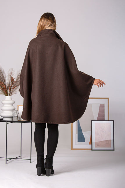 Back view of elegant off-white cape with lapel and oversized fit