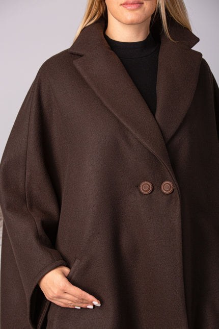 Close look of elegant off-white cape with lapel and oversized fit