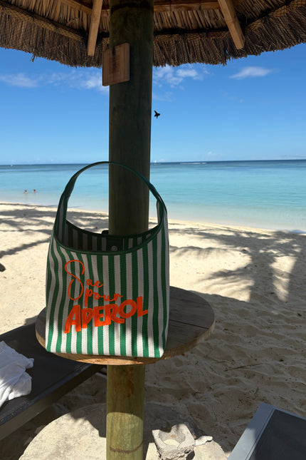 Lilly Loves Aperol Summer handbag with orange and white design, featuring a stylish hand strap and playful summer theme.