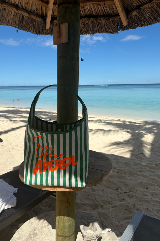 Lilly Loves Aperol Summer handbag with orange and white design, featuring a stylish hand strap and playful summer theme.