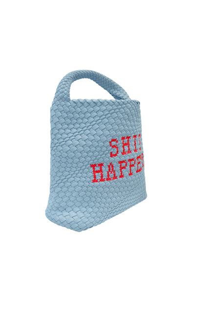 Lilly Loves Shit Happens bucket handbag with drawstring closure and stylish design, shown in natural beige fabric.