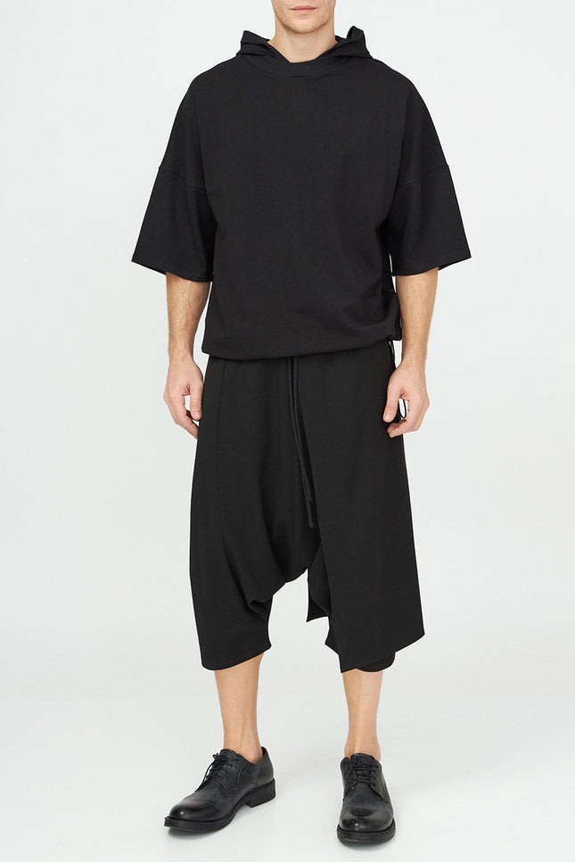 Unisex Hooded Top
Details: 
Black cotton T-Shirt
short sleeve 
hood 
ribbed neckline 
adjustable hem 
Composition:

Cotton 96% Elastane 4% 
Washing instructions
Dry Clean Only
FittinShirts & TopsAlchemy The LabelAlchemy The LabelUnisex Hooded Top