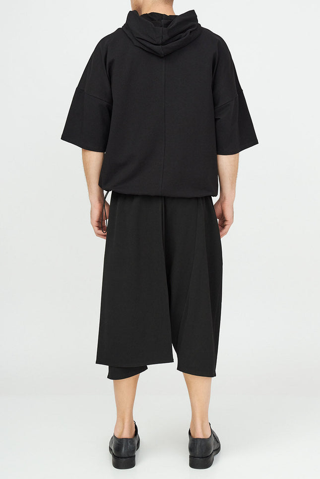 Unisex Hooded Top
Details: 
Black cotton T-Shirt
short sleeve 
hood 
ribbed neckline 
adjustable hem 
Composition:

Cotton 96% Elastane 4% 
Washing instructions
Dry Clean Only
FittinShirts & TopsAlchemy The LabelAlchemy The LabelUnisex Hooded Top