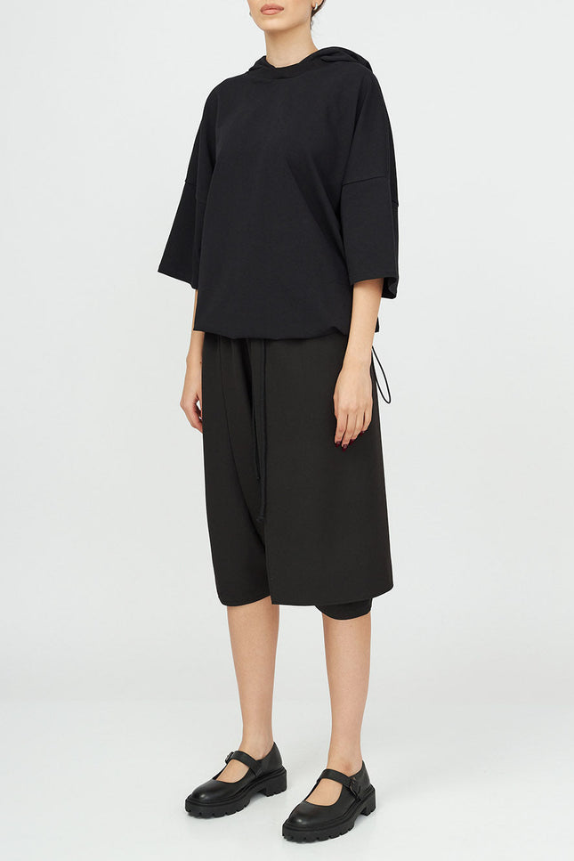 Unisex Hooded Top
Details: 
Black cotton T-Shirt
short sleeve 
hood 
ribbed neckline 
adjustable hem 
Composition:

Cotton 96% Elastane 4% 
Washing instructions
Dry Clean Only
FittinShirts & TopsAlchemy The LabelAlchemy The LabelUnisex Hooded Top