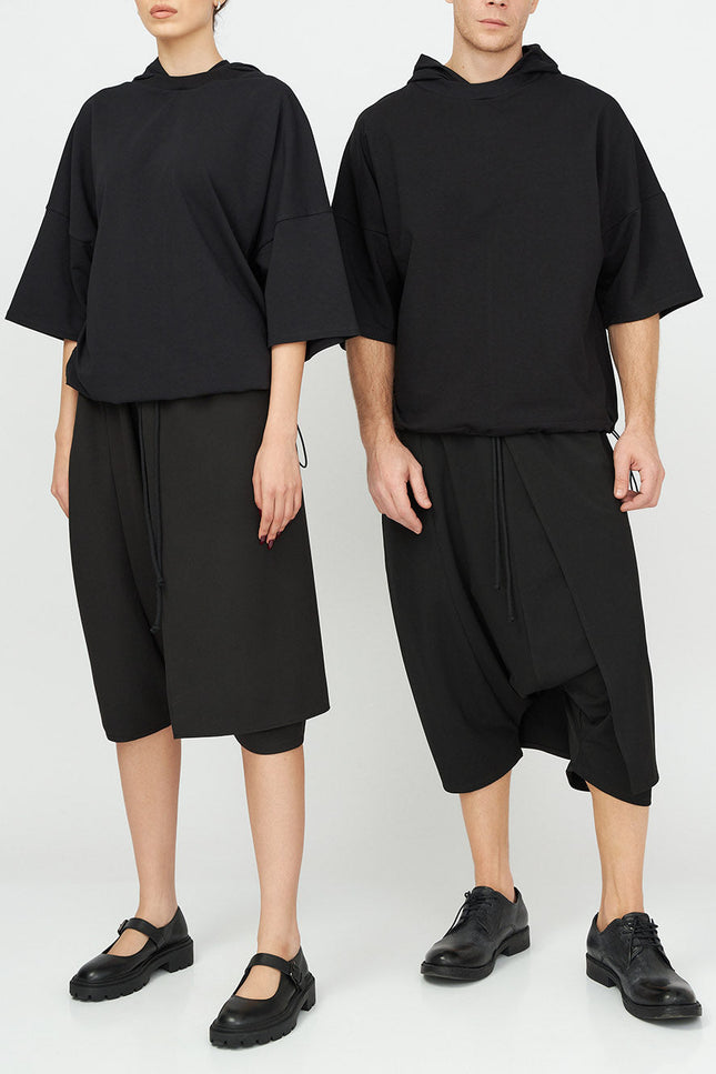 Unisex Hooded Top
Details: 
Black cotton T-Shirt
short sleeve 
hood 
ribbed neckline 
adjustable hem 
Composition:

Cotton 96% Elastane 4% 
Washing instructions
Dry Clean Only
FittinShirts & TopsAlchemy The LabelAlchemy The LabelUnisex Hooded Top