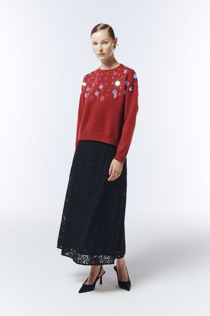 Model wearing SOUR FIGS Sequin-Embellished Jumper in burgundy red with black lace skirt.