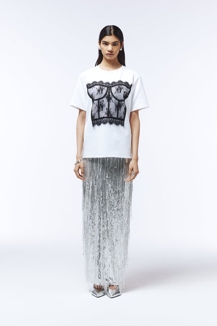 Model wearing short-sleeve T-shirt with sheer lace corset detailing