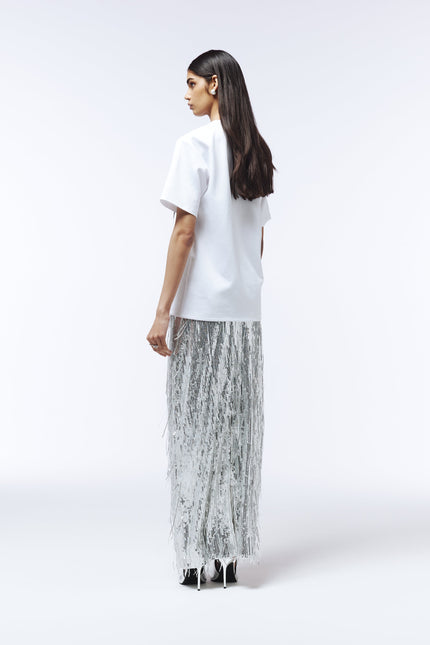 Lace-appliquéd white T-shirt styled with tailored trousers