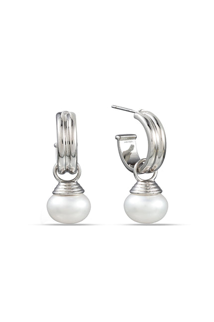 A pair of sterling silver hoop earrings with pearls attached to them, displayed against a white background.