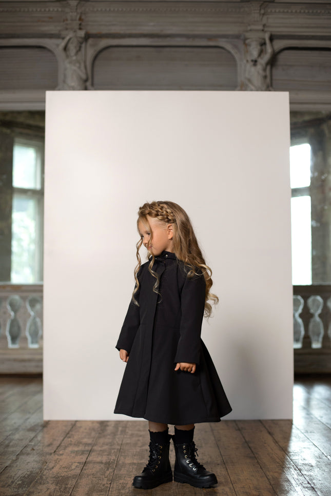Fitted and flared black raincoat for girls
