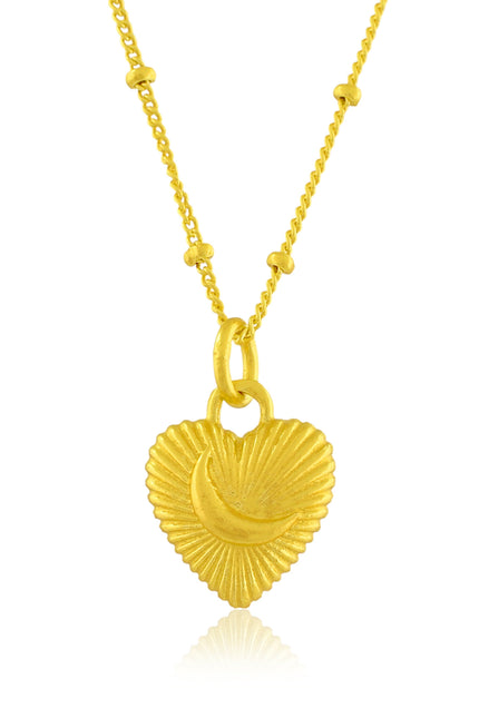 Gold heart-shaped pendant necklace on a white background