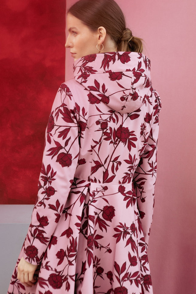 Back view of the Peony Bloom coat on Model, highlighting two large pleats on the back and the elegant flare.