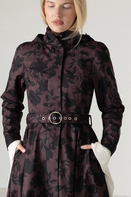 Close-up of the matching buckle belt and elegant black floral print on the Women's Brown Floral Fit and Flare Coat Brocade Dusk.