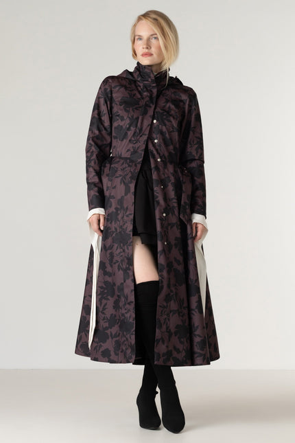 Women's Brown Floral Fit and Flare Coat Brocade Dusk worn open, revealing the luxurious black Italian satin lining and beautifully tailored fit-and-flare design.