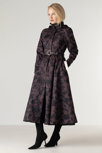 Full-length view of the Women's Brown Floral Fit and Flare Coat Brocade Dusk, featuring a deep brown color, elegant black floral print, flowing A-line skirt, black Italian satin lining, and a matching buckle belt.