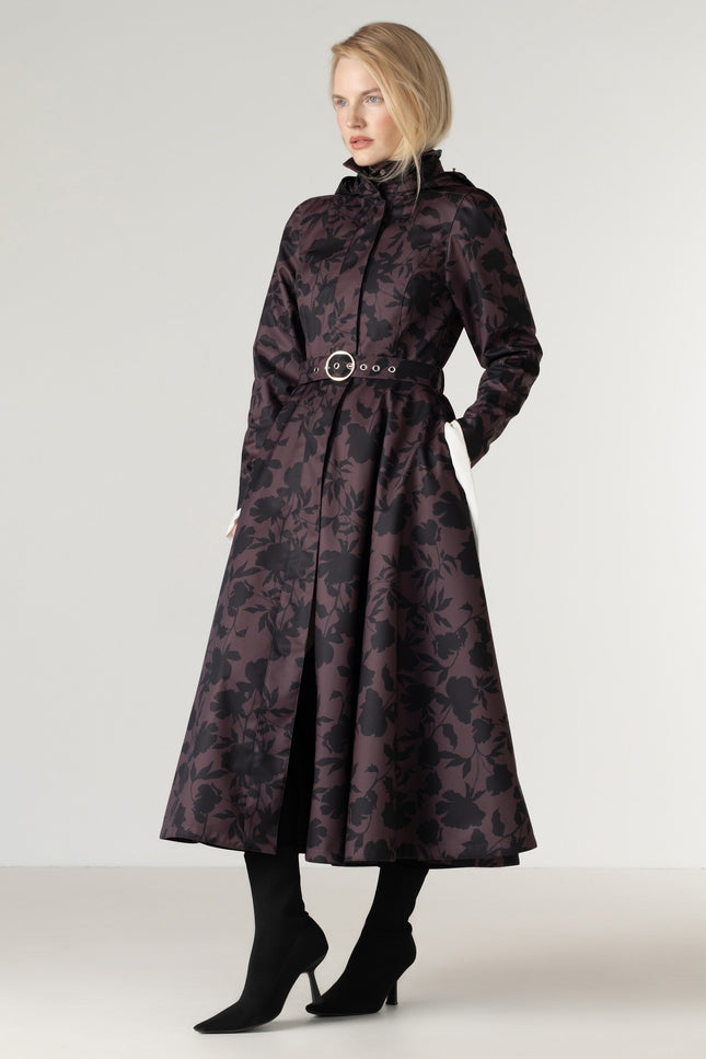 Full-length view of the Women's Brown Floral Fit and Flare Coat Brocade Dusk, featuring a deep brown color, elegant black floral print, flowing A-line skirt, black Italian satin lining, and a matching buckle belt.