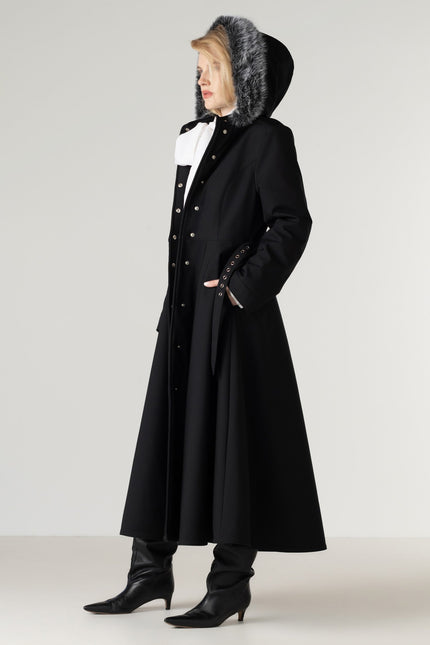 Women's black winter coat with detachable faux fur, showcasing the luxurious trim and premium craftsmanship.