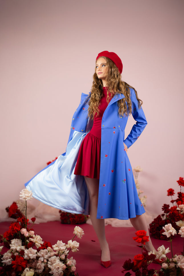 Detailed view of the coat’s gold-tone belt hardware and high-quality Italian satin lining.