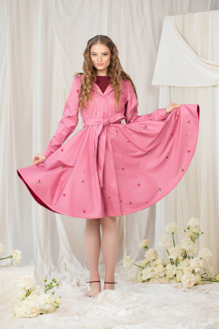 Pink coat that has red satin lining