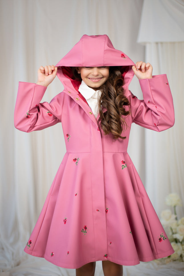 Adorable pink girls' coat with a classic cut and soft satin lining