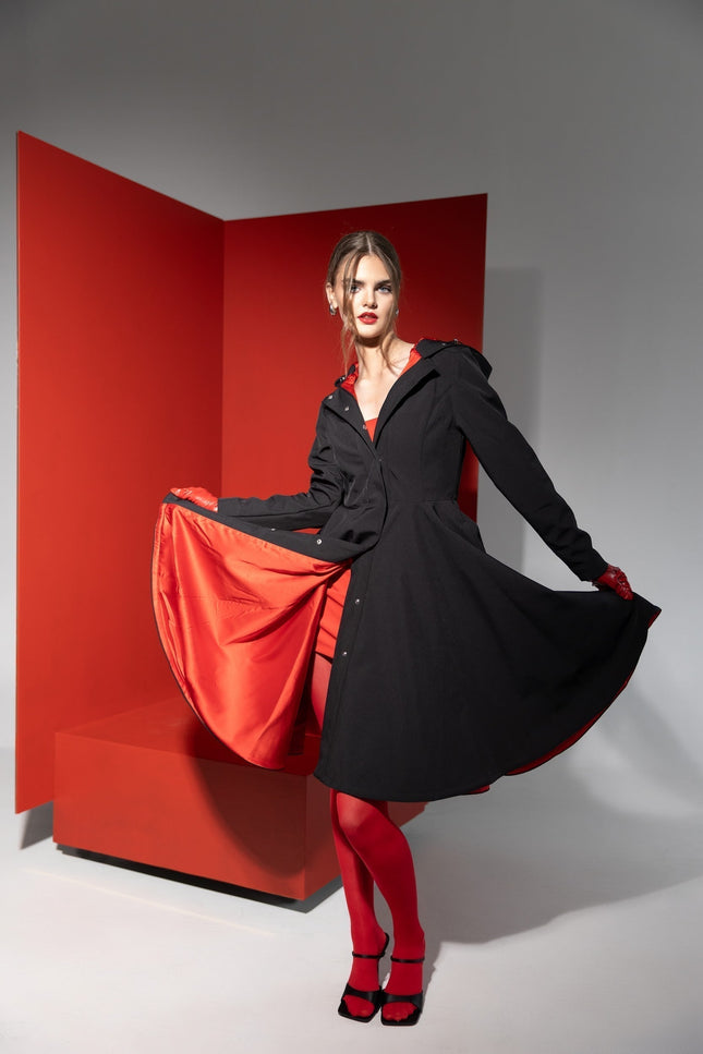Raven Red coat comes in black color and has vivid red color lining by RainSisters