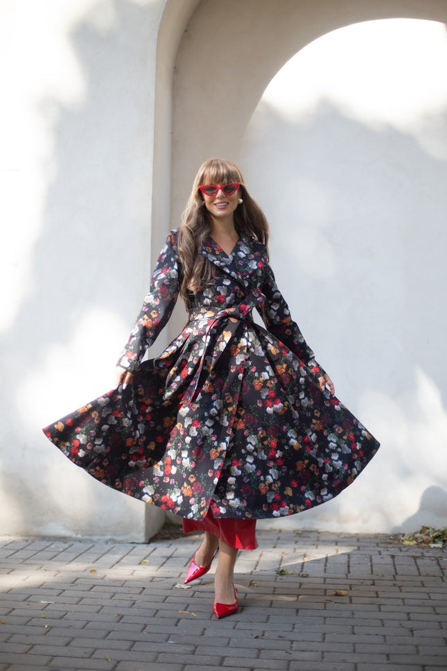 Rose Garden coat with tie belt accessory – feminine waist-defining look on model.