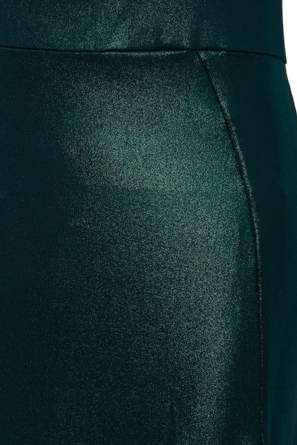 A close up of a woman's Sarvin Green Cut Out Side Dress.