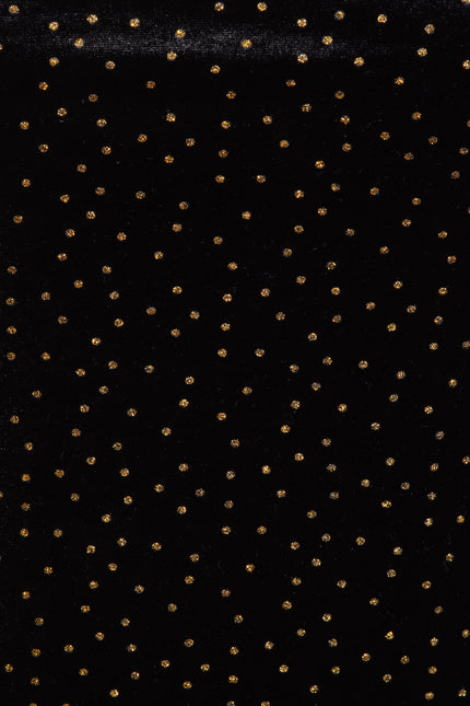Inspired by Sarvin's Black Polka Dot Dress, this black background with evenly spaced gold dots echoes chic polka dot style—ideal for creating a stunning wedding guest dress.