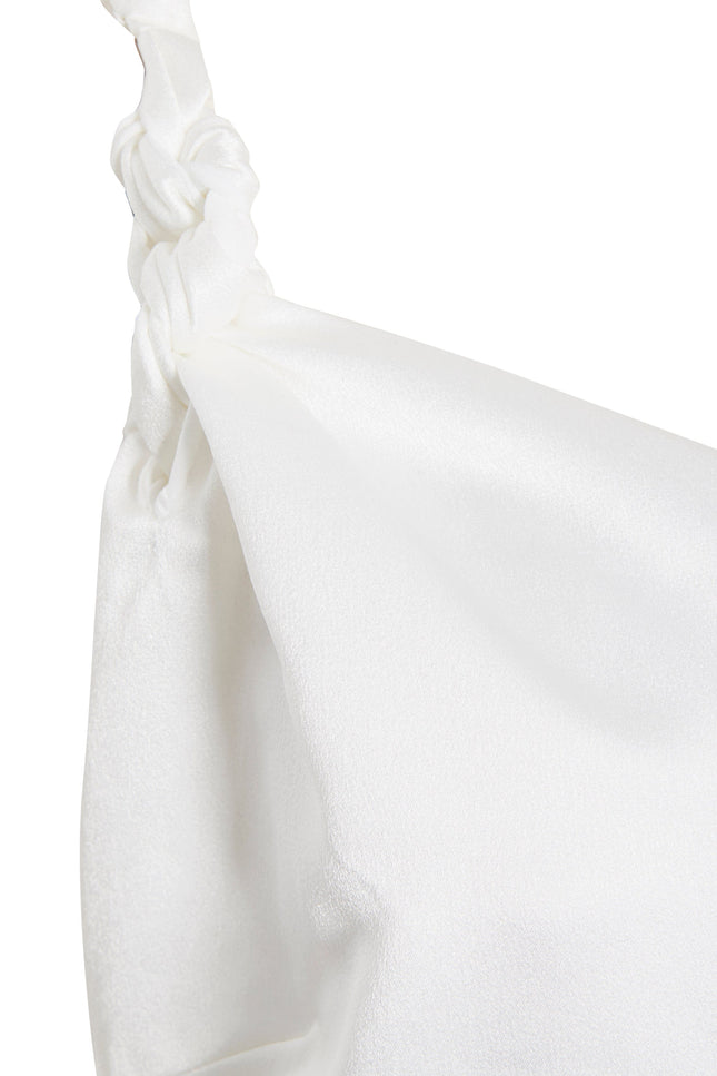 Close-up of the Ivory Satin A-Line Backless Mini Slip Dress by Sarvin, showing a knotted detail at the top left that highlights the dress’s smooth, shiny satin texture and elegant drape.