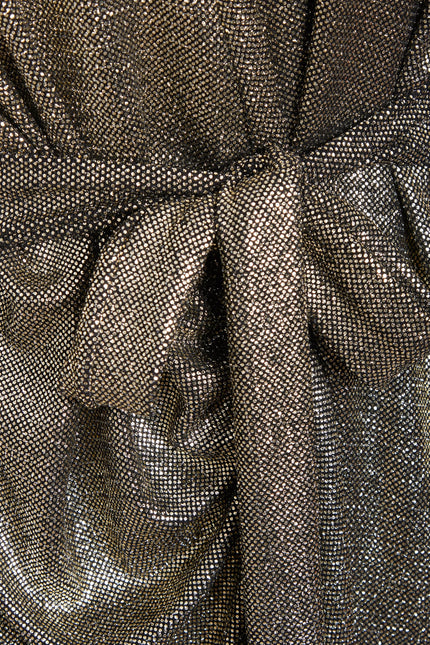 Close-up of Sarvin's Long Sleeve Sequin Wrap Dress, featuring a shiny, mesh-like gold fabric with a central knot detail—perfect for glamorous evening wear.