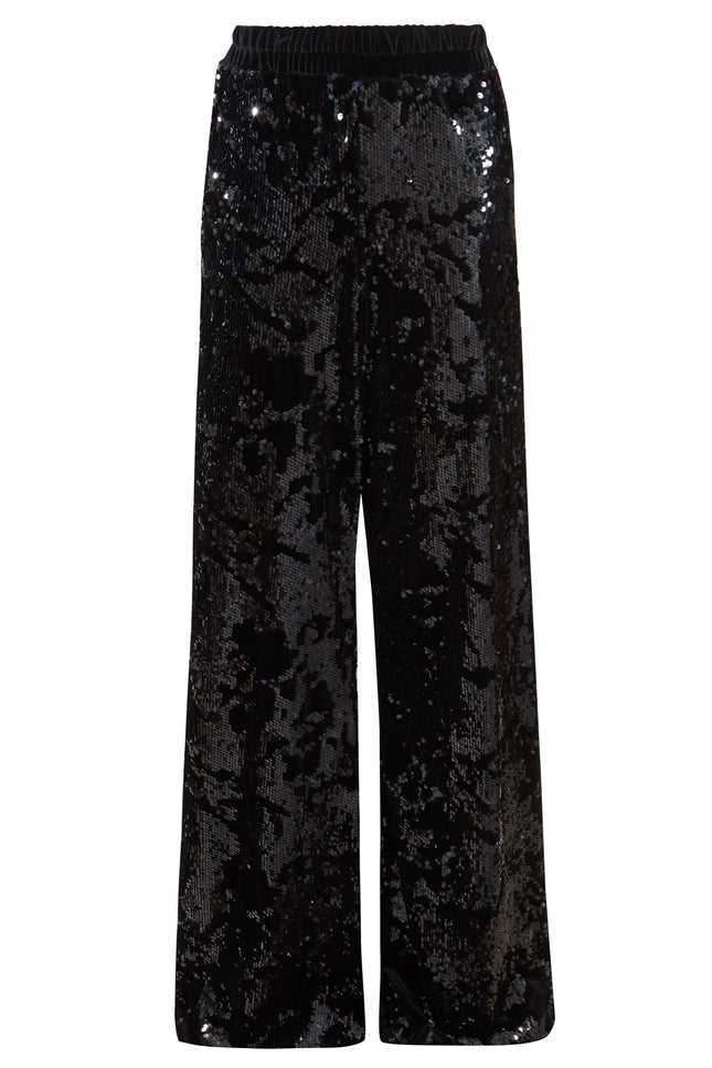 Sarvin Sequin Velvet Flared Trousers, handmade in the UK with an elastic waistband and shimmering black sequins, are showcased against a plain white background.