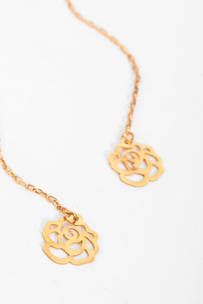 Sarvin's Flower Shape 18K Gold Drop Earrings, designed with rose-inspired shapes, are displayed elegantly on a white background.