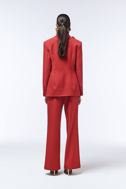 Back view of SOUR FIGS rose-detail blazer with sharp tailoring and contoured seams.