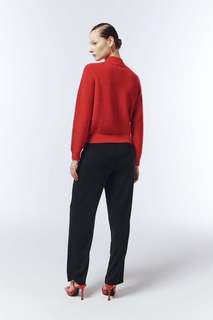 Back view of red jumper with relaxed silhouette designed by SOUR FIGS