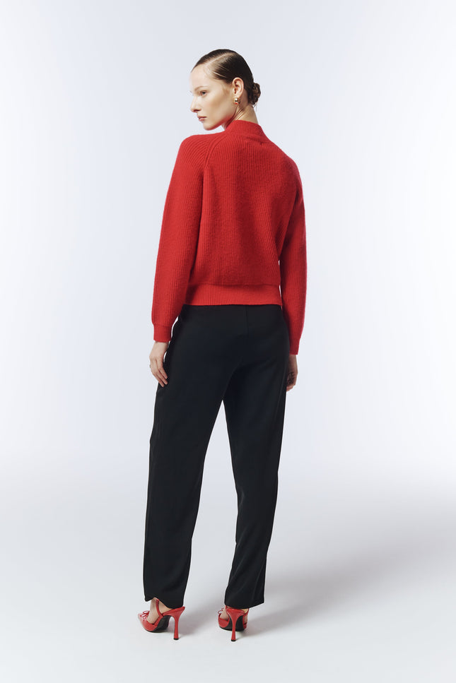 Back view of red jumper with relaxed silhouette designed by SOUR FIGS